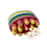 The Dirty Soap Blossom Massage Bar, infused with essential oils and featuring vibrant stripes with rounded pink and yellow accents, is artistically displayed next to white cherry blossom flowers on a white background.