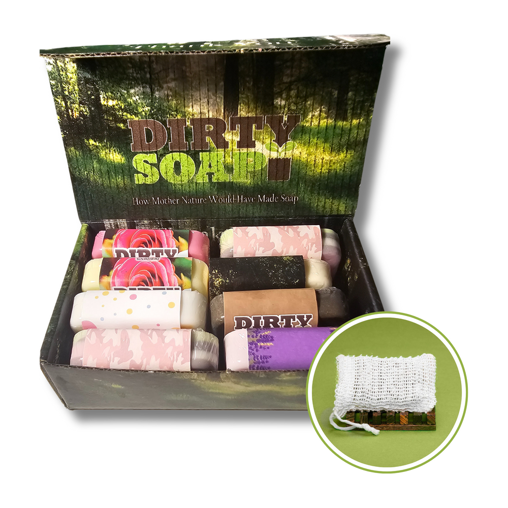 Dirty Soap Mini Bars by Dirty Soap displayed in an open box, showcasing colorful mini bars; inset highlights a white exfoliating soap saver bag set against a green background.