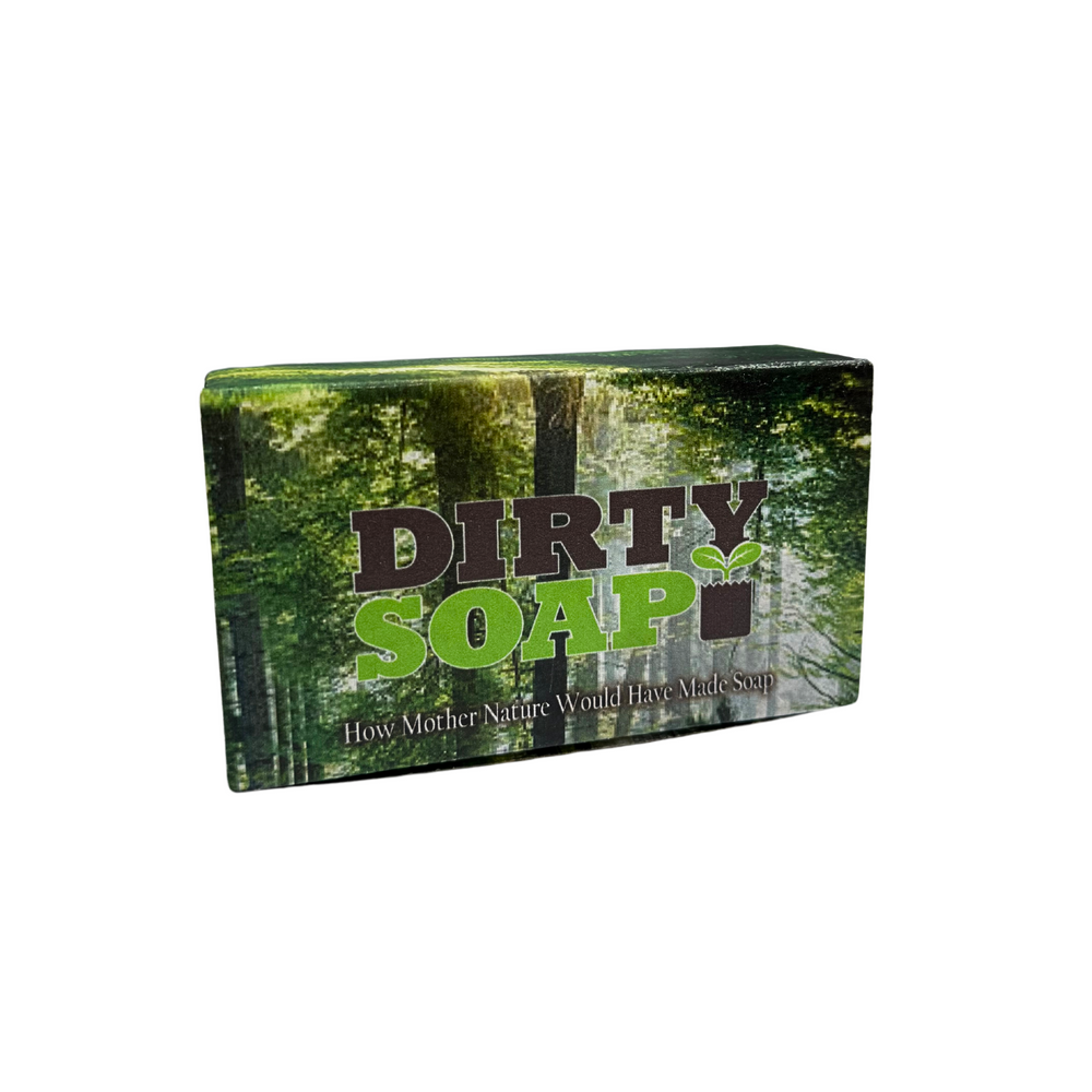 A Whipped Body Butter Sampler from Dirty Soap sits in a box labeled "DIRTY SOAP" against a forest backdrop, with the tagline "How Mother Nature Would Have Made Skincare.