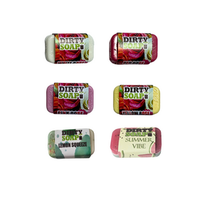 Six colorful Dirty Soap Mini Bars from the Sampler Set—featuring exfoliating bars in scents like White Rose, Lemon Squeeze, and Summer Vibe—are neatly arranged as perfect soap samples or a vibrant gift box.