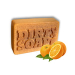 A rectangular Burnt Orange & Turmeric with Safflower Oil Bar Soap from Dirty Soap Bubbles sits next to whole and sliced oranges with green leaves, highlighting the fresh appeal of handmade bar soaps.