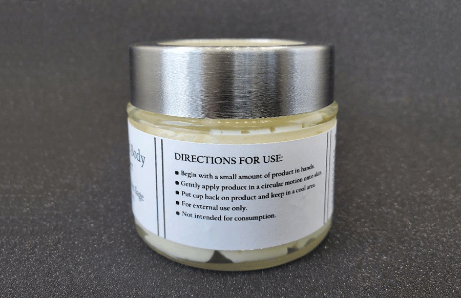 Jar of Dirty Soap Bubbles Cedarwood And Sage Whipped Body Butter with directions for use on the label.