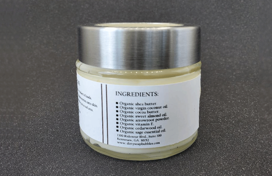 A jar of Cedarwood And Sage Whipped Body Butter from Dirty Soap Bubbles, featuring an ingredients label visible.