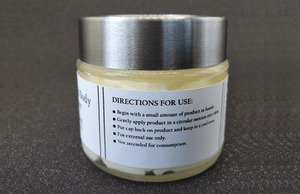 Clear glass jar with a silver lid containing Original Whipped Body Butter made from natural ingredients, including Shea Butter, labeled with directions for use indicating topical application only by Dirty Soap Bubbles.